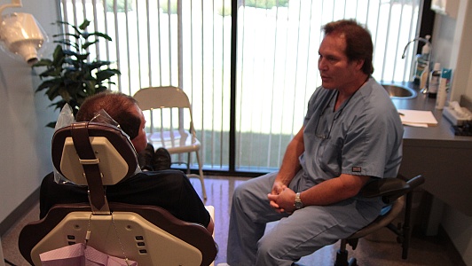 Fort Wayne's Dr. Steven Lee DDS consults with a patient